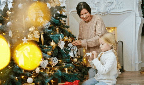 New year, new Will image - Mother and daughter decorating Christmas tree