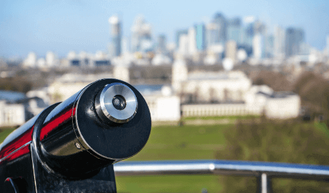 A telescope looking over London's Canary Wharf to signify looking ahead to the future of work
