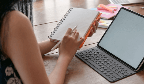 notepad by laptop