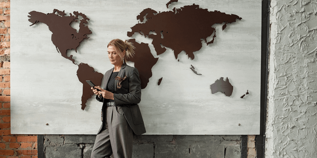 Businesswoman in front of international trade board