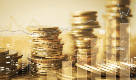 Coins and line graphs to demonstrate a foreign exchange