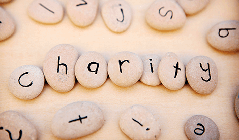 Pebbles with printed letters ordered to say 