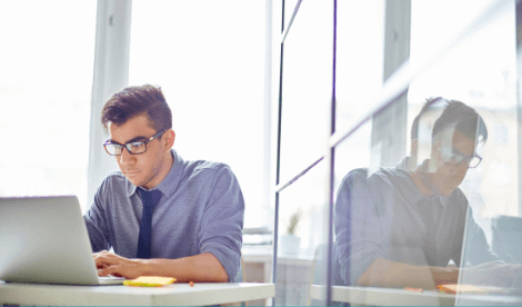 A business man working intensively in front of laptop