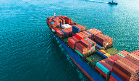 A large cargo shipping container ship in the wide ocean