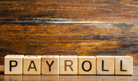 Payroll written on wooden blocks