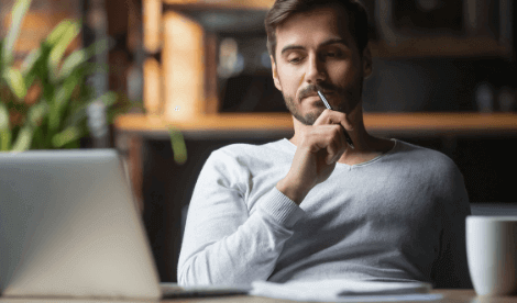A man thinking at home about death in service or individual term protection