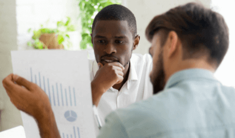 Man looking at financial report