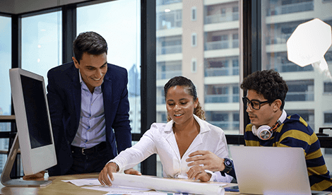 Business owner and employees discussing